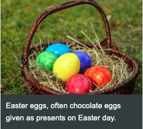 Basket of colourful Easter eggs resting on straw