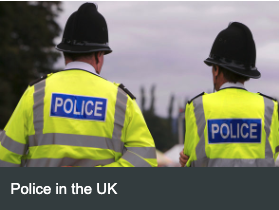Police Officers on patrol in the UK talking to members of the public